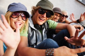 Young boys and girls sitting together and having fun